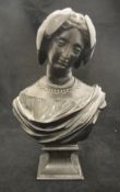 A late 19th/early 20th Century bronze bust of female form marked "Pradier" to base,