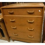 An Ernest Gomme for G Plan design chest of four drawers raised on square tapering legs,