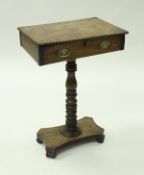A 19th Century rosewood rectangular work table, the lift top with applied beaded edge,