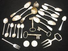A bag of assorted silver and plated wares to include a pair of Victorian silver table spoons (by