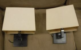 A box containing a pair of glass table lamps, a pair of wall lights,