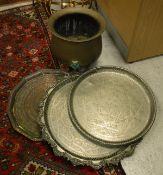 Three various engraved metal trays and a brass cauldron / log container
