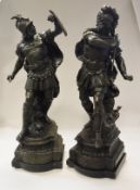 A pair of 19th Century Spelter figures as warriors raised upon a stepped ogee bracket on plinth