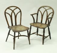 A composite set of four 19th Century Thames Valley kichen chairs of gothic form,