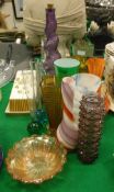 A collection of glass ware to include one carnival glass bowl, bud vases, a cased Lindshammer vase,