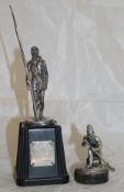 A silver figure of a soldier with rifle, bears makers mark "TS", other marks rubbed,