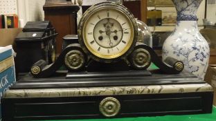 A Henry Marc of Paris marble mantle clock with Roman numerals and enamelled dial
