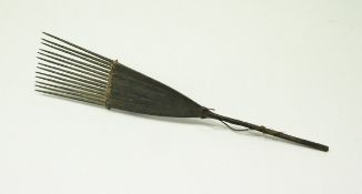 A 19th Century wooden comb bearing label "Comb Solomon Islands" CONDITION REPORTS