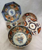 An Imari bowl, the central field decorated with flowers in vase,