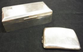 A George V silver cigarette box (Birmingham 1922) with engine turned decoration to front and back,