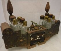 A Turkish copper shoe shining kit with twelve assorted glass bottles and assorted compartments,