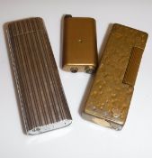 A Cartier cigarette lighter and a Dunhill lighter (2)