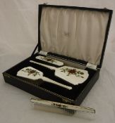 A silver four part vanity dressing table set, to include two brushes,