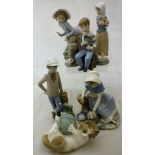 A collection of ten Lladro figurines of children and kittens