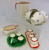 A Jessie Tait for Midwinter part dinner and tea wares decorated in a cream ground with red and