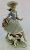 A Lladro figurine of "A girl jumping over a log carrying flower basket and with a puppy at her
