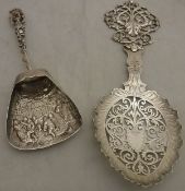 An Edwardian decorative sifter spoon with scrolling foliate decorated handle and bowl (by