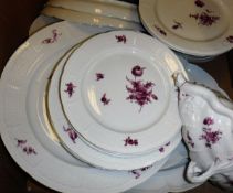 A collection of Nymphenberg dinner and tea wares with puce floral spray decoration