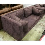 A pair of Alcantara fabric wine coloured three seat sofas on aluminium square supports