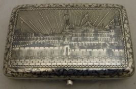 A Russian silver niello case with palace decoration to the front, monogrammed verso,