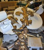 A box of assorted modern gilt decorated wall brackets and a pair of carvings