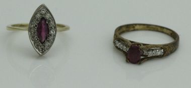 An 18 carat gold ruby and chip diamond ring, set within a pinched oval,