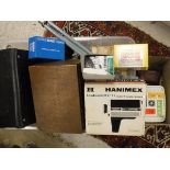 A box of assorted vintage camera equipment to include a box Brownie, a Kodak Instamatic 100 camera,