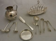 A collection of various silver plated wares to include a jersey cream jug, six section toast rack,