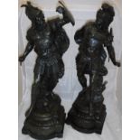 A pair of 19th Century Spelter figures as warriors raised upon a stepped ogee bracket on plinth