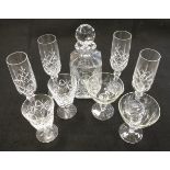 A large selection of cut glass to include champagne glasses, wine glasses,
