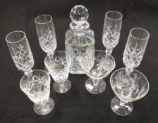 A large selection of cut glass to include champagne glasses, wine glasses,