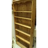 A modern pine seven tier adjustable bookcase, a painted wooden bookcase,