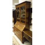 A good quality mahogany and inlaid bureau bookcase in the George III manner,