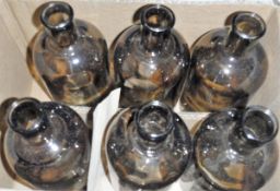 Five assorted boxes of decorative glass bottles,