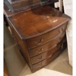 A modern mahogany revolving bookcase together with a bow fronted chest of four drawers