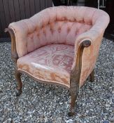 A circa 1900 button upholstered tub chair withcarved mahogany show frame in Louis XV taste raised