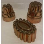 Three Victorian copper jelly moulds to include a mould stamped "22",