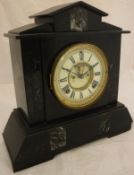 A black slate mantle clock with Roman numerals to the enamel dial