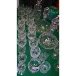 A collection of crystal cut glassware to include three decanters, one by Royal Doulton,