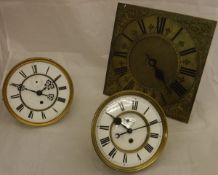 A chiming long case clock movement with Roman numerals to the brass dial,
