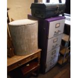 A painted four drawer metal filing cabinet, two Lloyd Loom linen baskets,