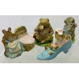 A collection of four Beswick Beatrix Potter figurines including "Mr Jeremy Fisher" (gold back