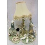 Four items of Lladro to include "Girl seated with piglets at her feet",