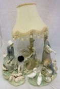 Four items of Lladro to include "Girl seated with piglets at her feet",