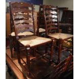 A set of six modern rush seat ladderback chairs in the 17th Century style on bobbin turned supports,