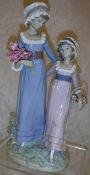 A Lladro figural group of "A lady with child carrying flowers"