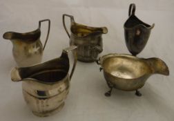 Four various Georgian silver cream jugs, together with a silver sauceboat, 16.