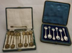 A cased set of six Britannia silver teaspoons with trefoil handles,