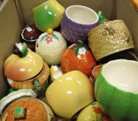 A box containing assorted novelty jam and honey pots,