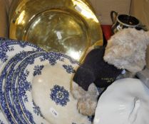A box containing various brass plates, blue and white decorative plates, assorted jewellery,